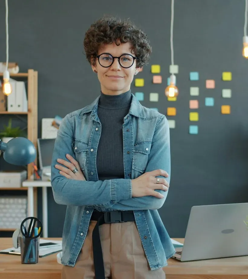 Teacher standing in a modern classroom, ready for an AI video interview